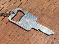 Load image into Gallery viewer, GM Mark of Excellence Key Bottle opener Key Chain

